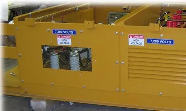 Yellow mining transformer with ventilation louvers and electrical labeling for underground mining applications