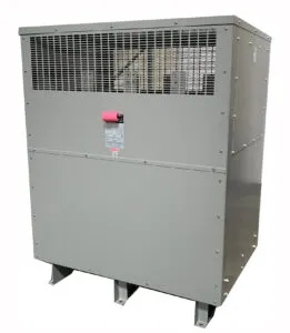 Industrial 750 kVA transformer unit in gray metal enclosure with ventilation grilles and pink disconnect switch