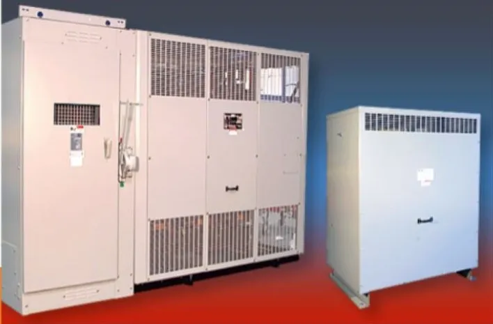 Large industrial electrical transformers with cooling vents and control panels displayed on red flooring