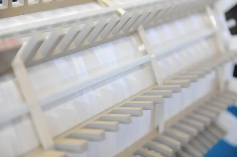 Rows of white industrial transformers with metal fins displayed in product gallery