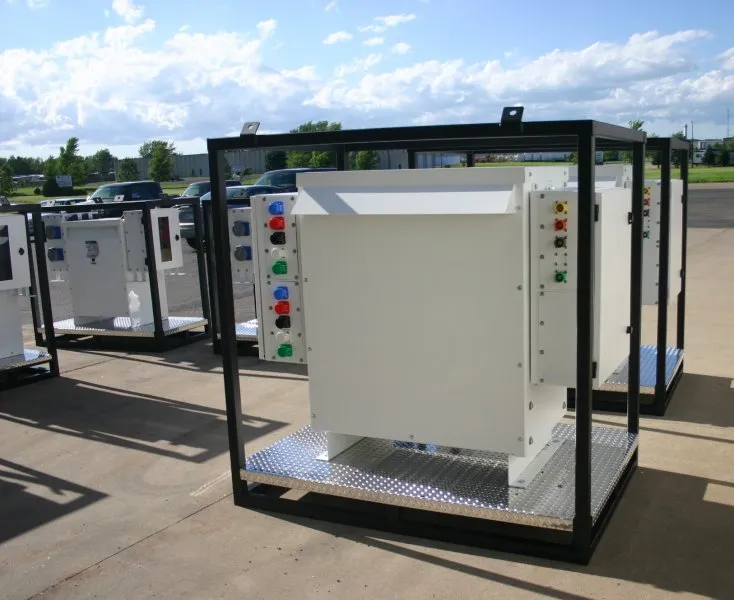 Industrial electrical enclosure with control panel and colored indicator lights on outdoor display lot