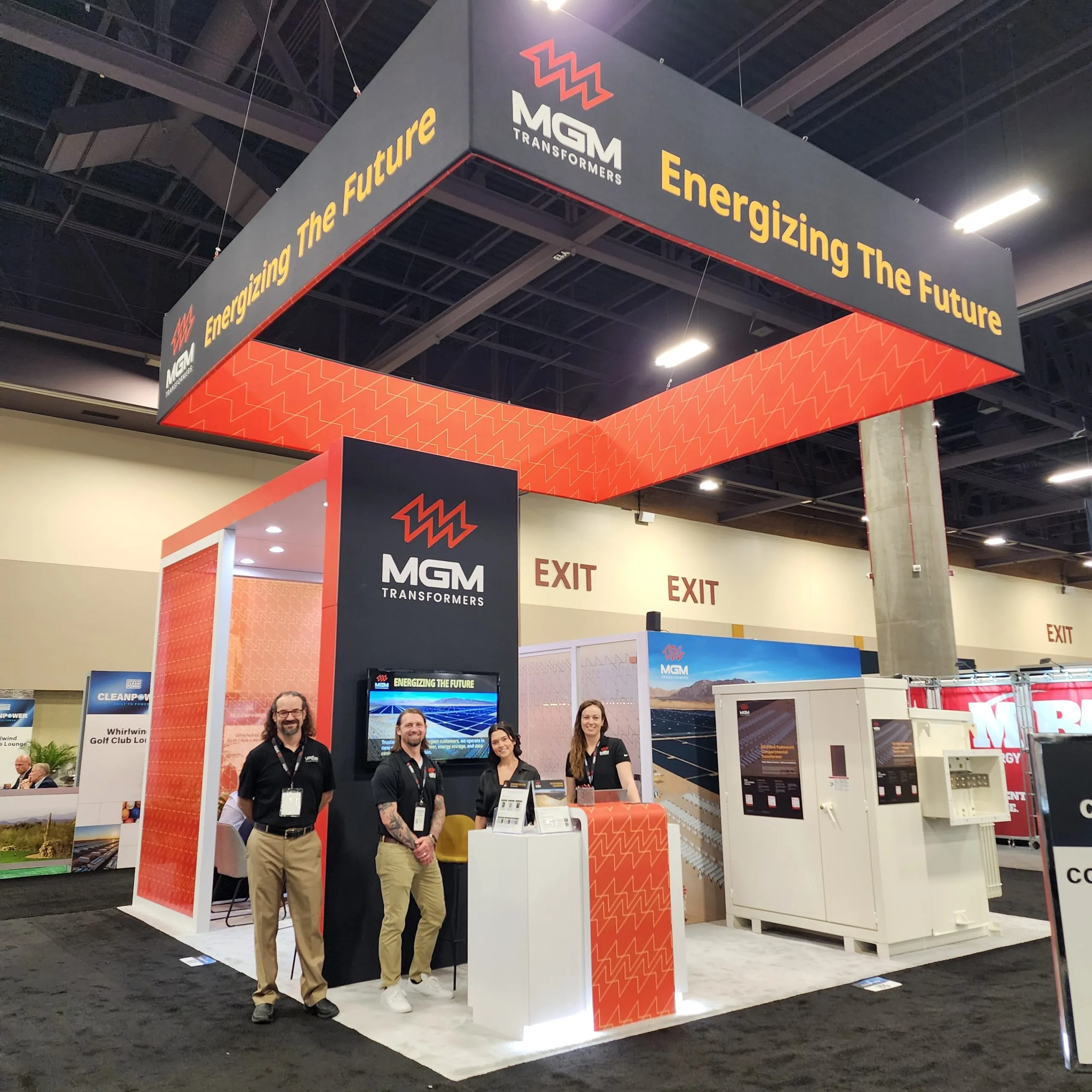 MGM Transformers exhibition booth at ACP 2025 with staff members showcasing energy solutions and "Energizing The Future"