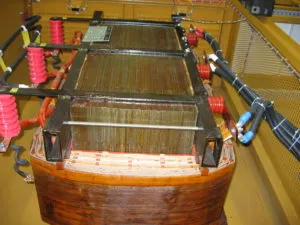 Low-profile transformer with wooden base and copper windings designed for underground mining applications